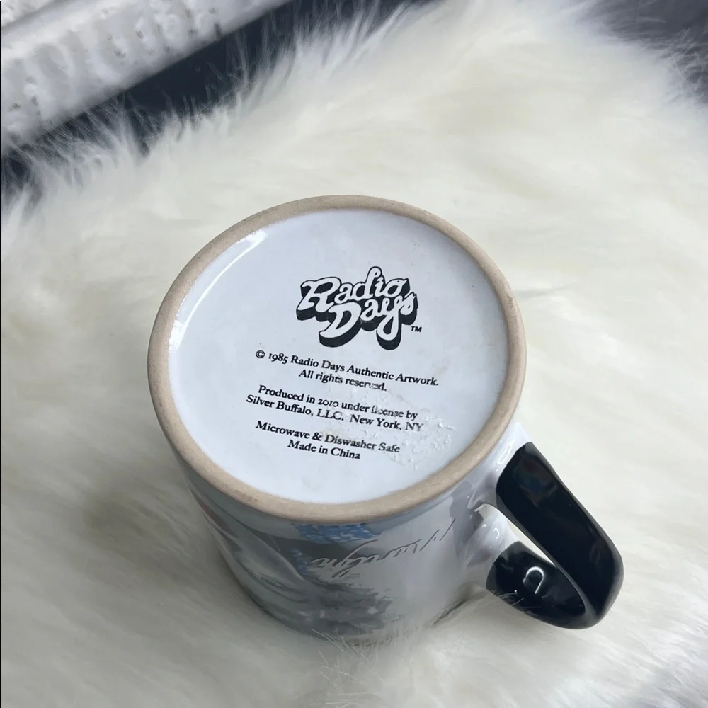Black and White Ceramic Mug with Iconic Portrait